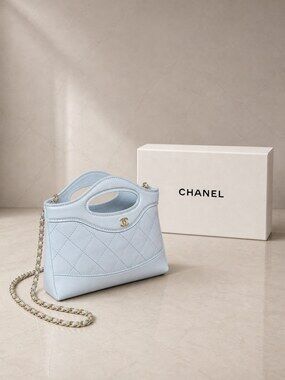 Chanel Nano Handbag in Light Blue Lambskin with Gold Tone Hardware
